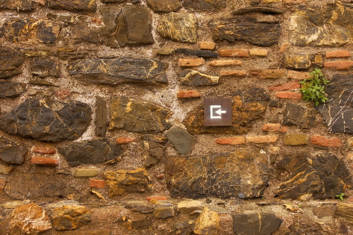 Arrow Sign on Wall